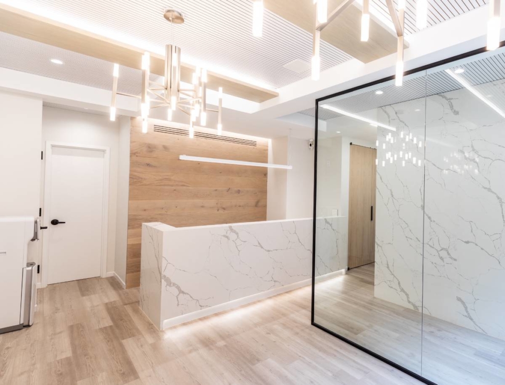 Reception with marble and warm wood detailing